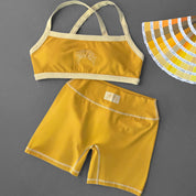 MID RISE COLOR BLOCK BIKER SHORT - AMBER
