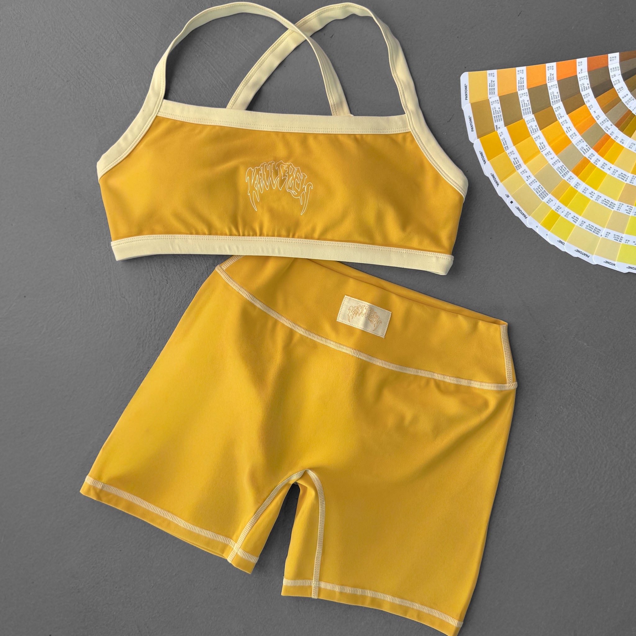 MID RISE COLOR BLOCK BIKER SHORT - AMBER