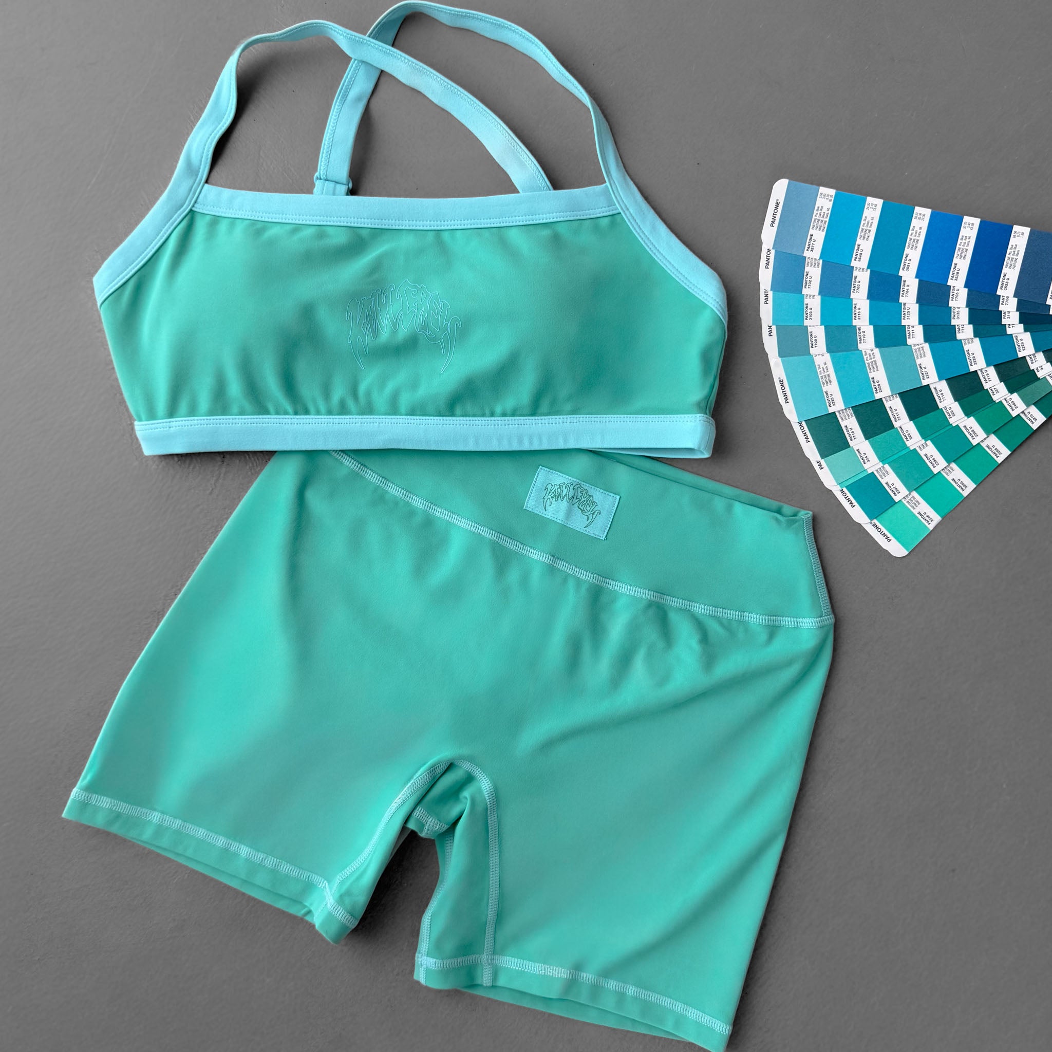MID RISE COLOR BLOCK BIKER SHORT - TEAL