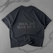 RELAXED FIT NATURAL COTTON "SWEAT & BLEED" T-SHIRT - BLACKOUT