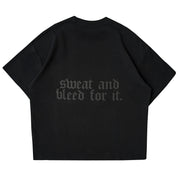 RELAXED FIT NATURAL COTTON "SWEAT & BLEED" T-SHIRT - BLACKOUT