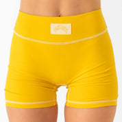 MID RISE COLOR BLOCK BIKER SHORT - AMBER